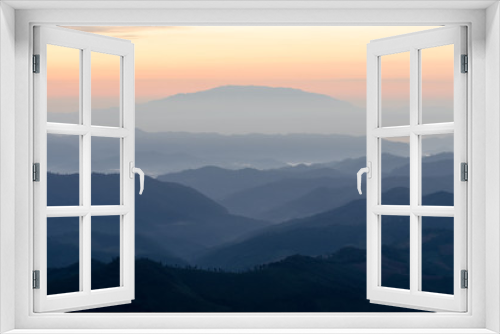 Fototapeta Naklejka Na Ścianę Okno 3D - Layer of mountains and mist during sunset