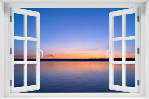 Fototapeta Naklejka Na Ścianę Okno 3D - Sky at dawn and peaceful lake; beautiful view of sunrise