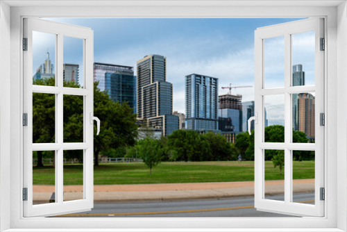 Fototapeta Naklejka Na Ścianę Okno 3D - Panoramic View of Downtown Austin Skyline from Riverside Dr Street with Mostly Clear Skies