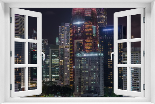 Fototapeta Naklejka Na Ścianę Okno 3D - Aerial cityscape of Singapore downtown of modern architecture with skyscrapers night timelapse