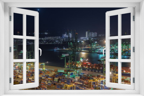 Fototapeta Naklejka Na Ścianę Okno 3D - Commercial port of Singapore aerial night timelapse.