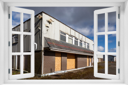 Fototapeta Naklejka Na Ścianę Okno 3D - Closed and boarded up commercial buildings on an industrial estate