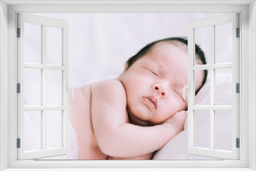 Smiling baby boy lying on a white bed, Family morning at home,Children hygiene.