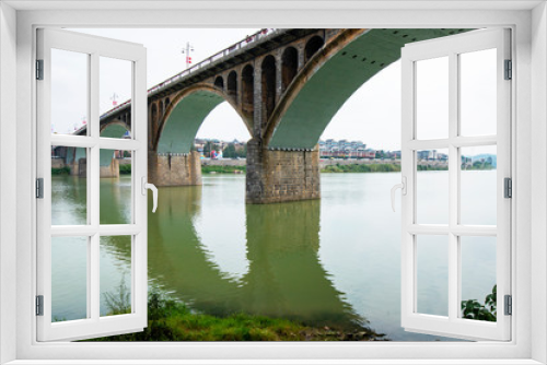 Fototapeta Naklejka Na Ścianę Okno 3D - An arch bridge over a river