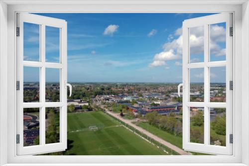 Drone Aerial view of of soccer fields and the buildings of the village of Grootebroek, which is part of urban planning. Photo make with a drone