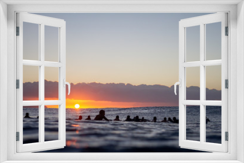 Fototapeta Naklejka Na Ścianę Okno 3D - Surfers waiting for waves at sunset
