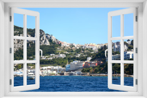 Fototapeta Naklejka Na Ścianę Okno 3D - Capri, Italy: Panoramic view from the Marina Grande to the town in the hills up above.