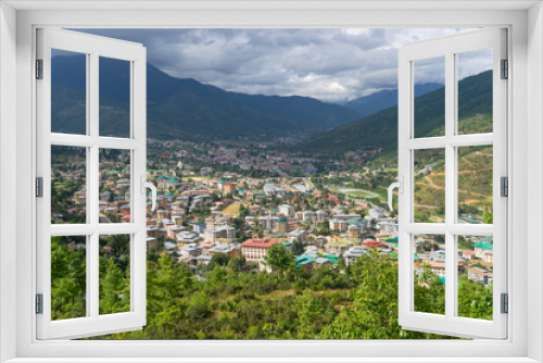 Top view Thimpu city, the capital of Bhutan surrounded by mountains in summer season