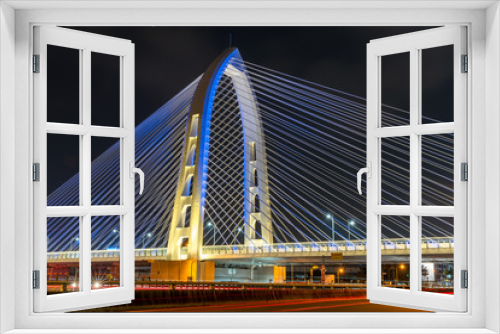 Fototapeta Naklejka Na Ścianę Okno 3D - Nightscape of new landmark Konan Ai-Qin Bridge in Taichung City, Taichung Central Park at the Xitun District Shuinan Economic and Trade Area. The second largest park in Taiwan