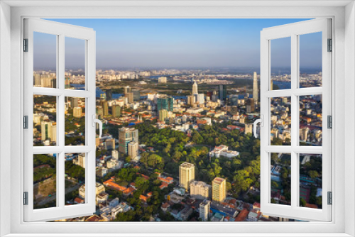 Fototapeta Naklejka Na Ścianę Okno 3D - Aerial panoramic cityscape view of Independence Palace or Reunification Palace and center Ho Chi Minh City, Vietnam with blue sky at sunset. 