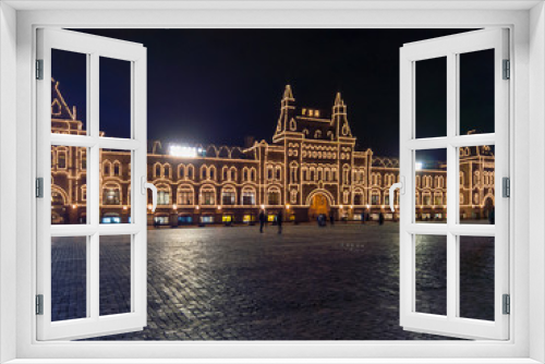 Fototapeta Naklejka Na Ścianę Okno 3D - Evening view of the GUM with illumination from the side of an empty red square as a symbol of quarantine