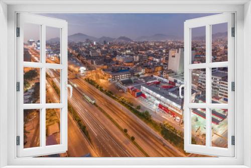 Fototapeta Naklejka Na Ścianę Okno 3D - Aerial view of Via Expresa highway and metropolitan bus with traffic day to night timelapse. Lima, Peru