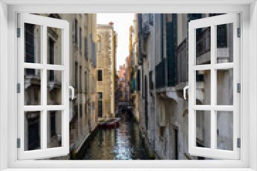 Fototapeta Naklejka Na Ścianę Okno 3D - Old narrow canal with parked boats quiet streets of Venice at summer morning. Traveling concept background, Italy