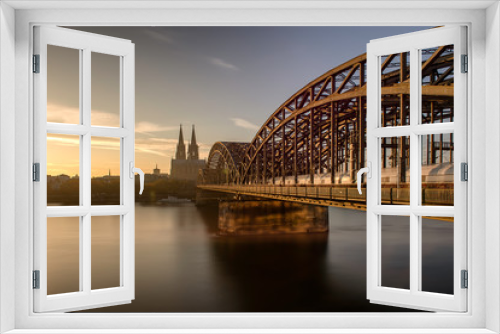 Fototapeta Naklejka Na Ścianę Okno 3D - Panorama of the Hohenzollern Bridge over the Rhine River and Cologne Cathedral by night, Cologne city skyline Germany,Skyline von Köln mit Kölner Dom und Hohenzollernbrücke bei Nacht.
