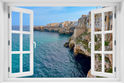 Fototapeta Naklejka Na Ścianę Okno 3D - Houses on dramatic cliffs over Adriatic Sea On A Sunny Autumn Day At Polignano a Mare- Apulia - Italy