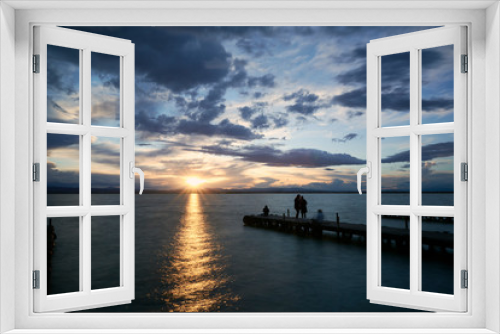 Fototapeta Naklejka Na Ścianę Okno 3D - Jetty on a lake a stormy day, sunset