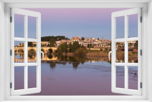 Badajoz city at sunset with river Guadiana in Spain