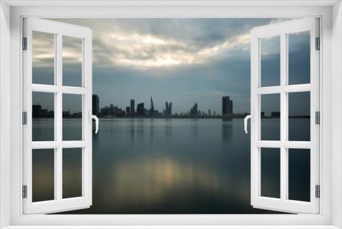 Fototapeta Naklejka Na Ścianę Okno 3D - Bahrain skyline with beautiful clouds and reflection on water