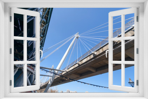 Fototapeta Naklejka Na Ścianę Okno 3D - A below view of the foot bridge and the railway in the Hungerford Bridge, London.