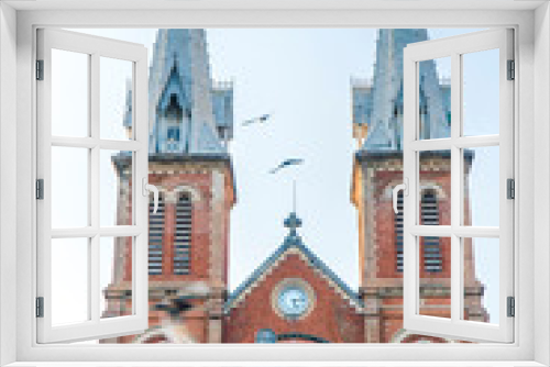 Saigon Notre-Dame Cathedral Basilica (Basilica of Our Lady of The Immaculate Conception) on blue sky background in Ho Chi Minh city, Vietnam. Ho Chi Minh is a popular tourist destination of Asia.