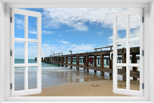 Fototapeta Naklejka Na Ścianę Okno 3D - Nature landscape. Amazing sandy tropical beach with bridge and tree in crystal clear sea and scenery wooden bridge out of the horizon / Palm and tropical beach.Close up.
