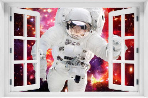 Fototapeta Naklejka Na Ścianę Okno 3D - Astronaut and galaxy on the backdrop. The elements of this image furnished by NASA.