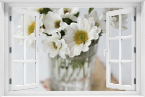 Fototapeta Naklejka Na Ścianę Okno 3D - chamomile flowers in a glass on the windowsill
