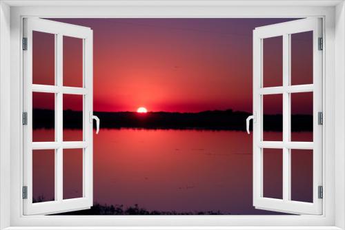 Fototapeta Naklejka Na Ścianę Okno 3D - Sunset over a lagoon