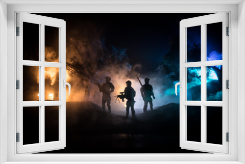 Fototapeta Naklejka Na Ścianę Okno 3D - War Concept. Military silhouettes fighting scene on war fog sky background, World War Soldiers Silhouette Below Cloudy Skyline At night.