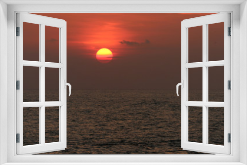 Fototapeta Naklejka Na Ścianę Okno 3D - A Beach view Landscape of a Sun set Photograph at Golden hour