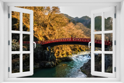 Fototapeta Naklejka Na Ścianę Okno 3D - Distinctive red wooden bridge in the mountain small town Nikko in japan