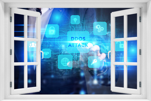 Business, Technology, Internet and network concept. Young businessman working on a virtual screen of the future and sees the inscription: Ddos attack