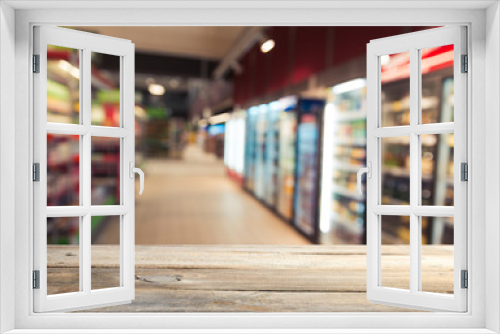 Supermarket background, Counter over blur grocery background, Wooden desk, table, shelf and blur woman shopping at supermarket, Wood counter for grocery store retail product display backdrop, template