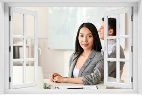 Asian businesswoman during meeting in office