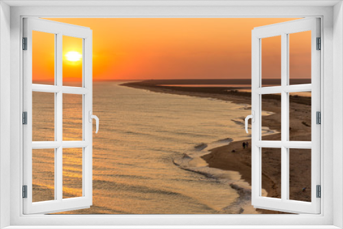 Fototapeta Naklejka Na Ścianę Okno 3D - Incredibly beautiful sunset on the sea with pink and red sky, sun, and clean sand.