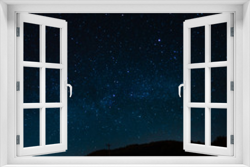 Fototapeta Naklejka Na Ścianę Okno 3D - Starry sky on a background of a slope, night landscape. Astrology, horoscopes, astro screensaver, space