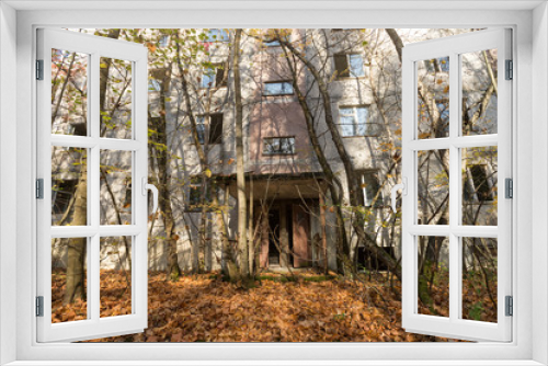 Fototapeta Naklejka Na Ścianę Okno 3D - Overgrown yard in abandoned ghost town Pripyat in Chernobyl zone