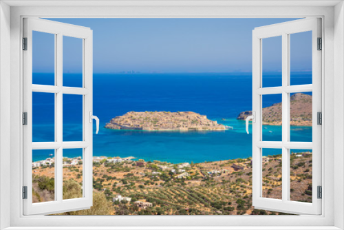 Fototapeta Naklejka Na Ścianę Okno 3D - View of the island of Spinalonga with calm sea. Here were isolated lepers, humans with the Hansen's desease, gulf of Elounda, Crete, Greece. 