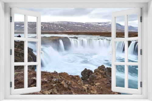Fototapeta Naklejka Na Ścianę Okno 3D - Two People Standing Above Godafoss Waterfall at Iceland