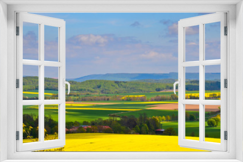 Fototapeta Naklejka Na Ścianę Okno 3D - A beautiful german agriculture landscape with light and yellow rape fields