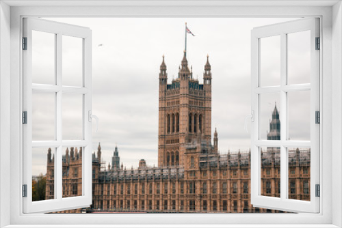 Fototapeta Naklejka Na Ścianę Okno 3D - London, UK - November 09, 2020: view on The Palace of Westminster exterior at cloudy weather