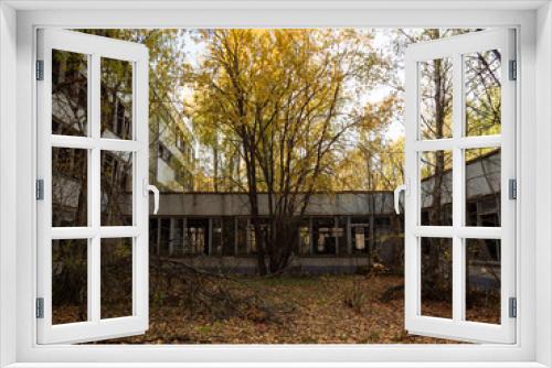 Fototapeta Naklejka Na Ścianę Okno 3D - Abandoned school building, taken by the nature and decaying. Chernobyl Exclusion Zone. Ukraine