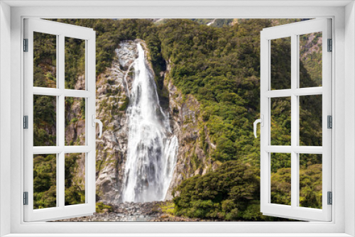 Fototapeta Naklejka Na Ścianę Okno 3D - Waterfall at Milford sound  in New Zealand. South Island.