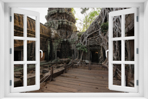 Fototapeta Naklejka Na Ścianę Okno 3D - Ta Prohm Temple, Angkor Temple overgrown by massive trees after abandoned for centuries, Siem Reap, Cambodia