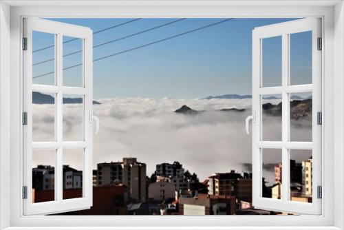 Fototapeta Naklejka Na Ścianę Okno 3D - At 3600 meters, a cloudy sky can hide a whole city. La Paz, Bolivia. 
