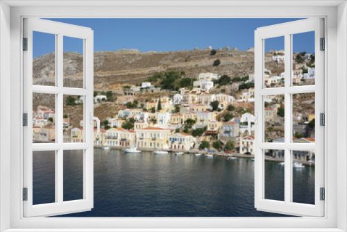 Fototapeta Naklejka Na Ścianę Okno 3D - Simi town houses and Mediterranean sea a Greek holiday island	