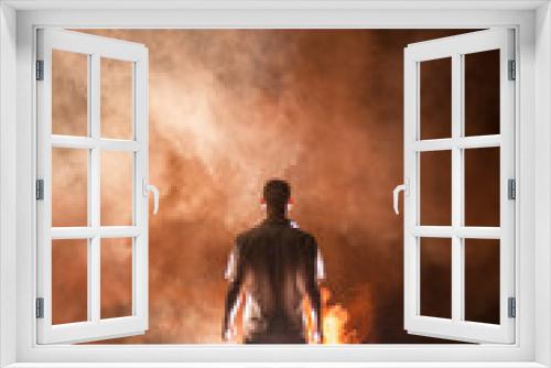 Fototapeta Naklejka Na Ścianę Okno 3D - young man in smoke