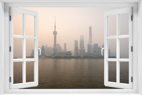 Fototapeta Naklejka Na Ścianę Okno 3D - Scenic Panoramic Cityscape of Shanghai, China during foggy morning weather with tall and unique skyscrapers making up the skyline 
