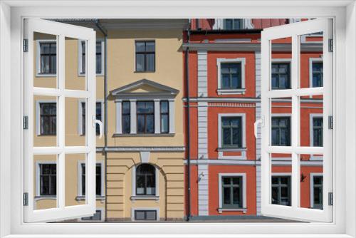 Fototapeta Naklejka Na Ścianę Okno 3D - Colorful facade with yellow and red of historic buildings
