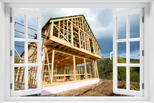 Fototapeta Naklejka Na Ścianę Okno 3D - Residential home construction, frame wooden house outdoor
